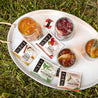 A tray of iced Numi teas, featuring Turmeric Amber Sun, Hibiscus, Moroccan Mint, and Jasmine Green