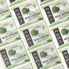 Numi Matcha Toasted Rice tea bags on a plain background