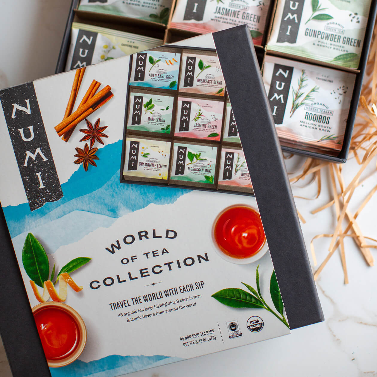 An open box of World of Tea on a countertop